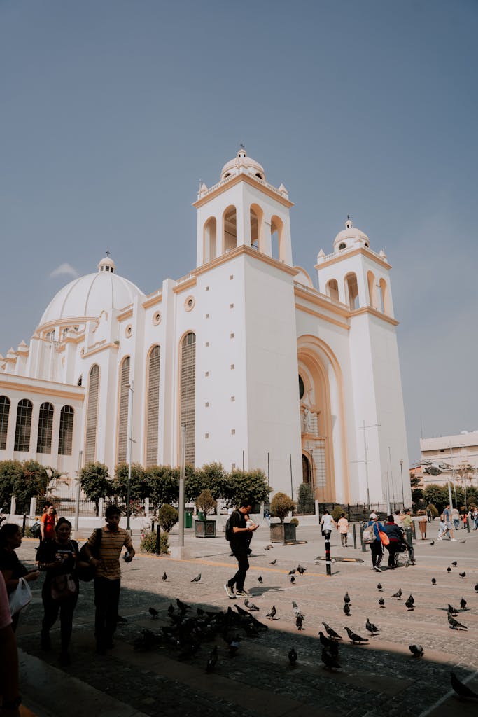 A stunning showcase of Romanesque architecture with bustling street life in San Salvador.