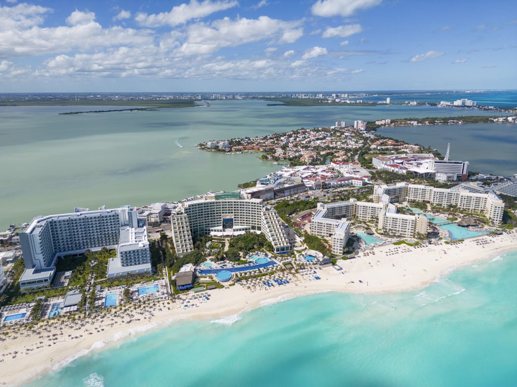 Stunning aerial shot of Cancun's pristine beaches and luxury resorts along the coast.