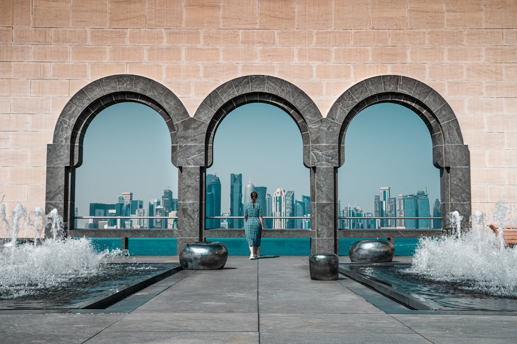 View of Doha skyline through Islamic arches at Museum of Islamic Art, Qatar.